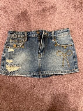 Edikted Blue Denim Mini Skirt with Studded Bow Detail